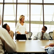 Group-of-professionals-having-meeting-in-boardroom