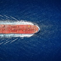 high aerial top view of a crude oil tanker traveling with speed
