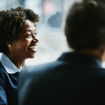 businesswoman in discussion with colleagues