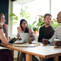 diverse business colleagues having a meeting around a boardroom table