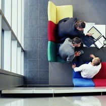 three businessmen in meeting, overhead view