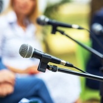 unfocused image of executives at roundtable event