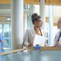 male and female hospital administrators discussing an issue