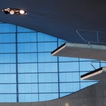 two indoor high diving platforms over empty pool