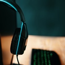 headphones hooked over monitor