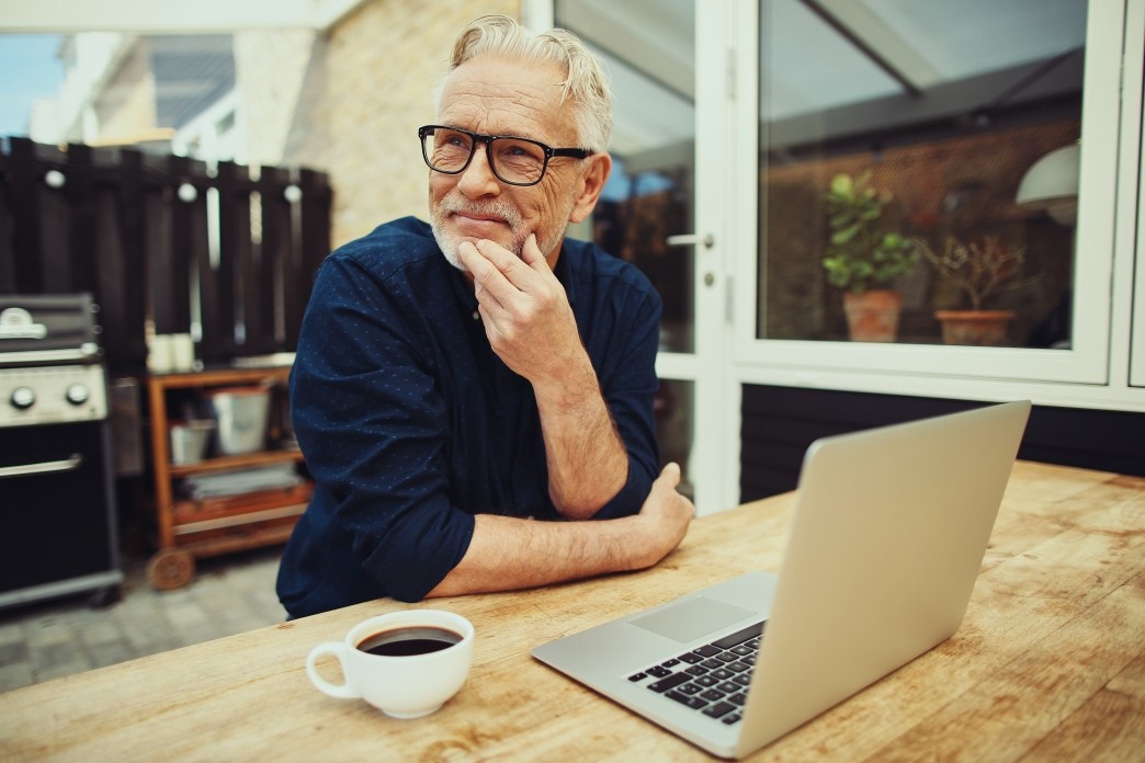 senior-man-outside-drinking-coffee