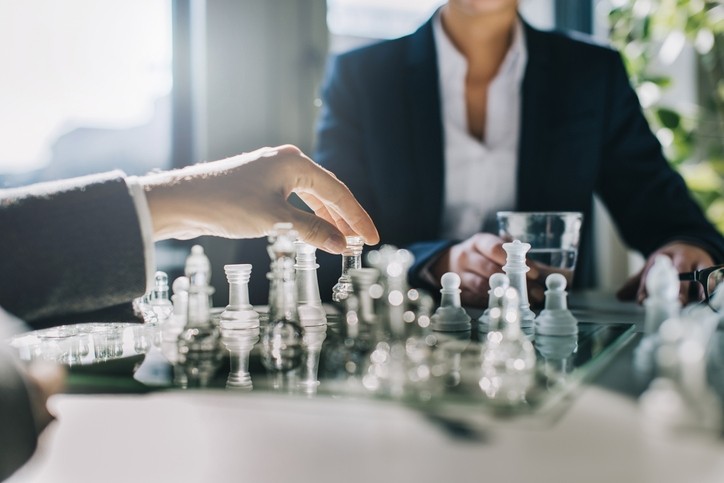 businesswoman playing chess