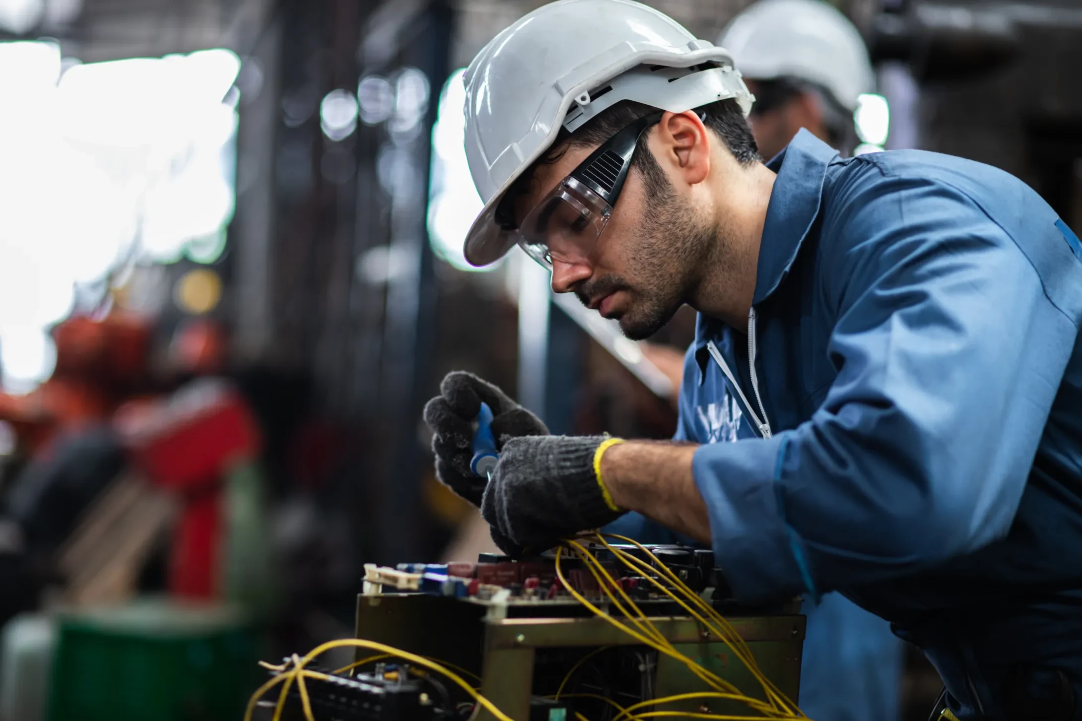 Engineer manual workers standing in a aluminum mill and working together