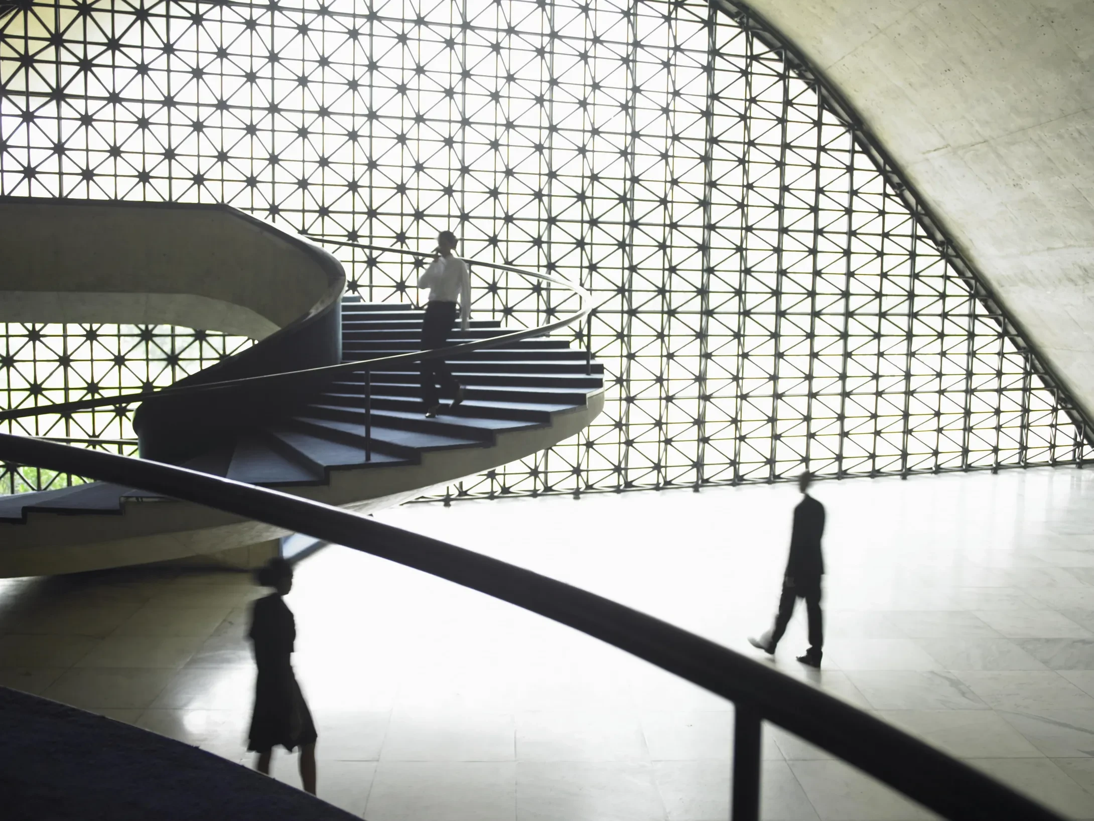 three people in business interior blurred motion